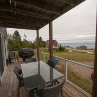 Chalet location Le Rassembleur; Petite Rivière Sant-François; Charlevoix; Versant ski Massif; Magnifique vue; Entièrement rénové; Aucun tapis. Balcon-terrasse.